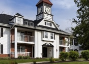 Thumbnail 18 of 19 - a building with a clock tower on top of it