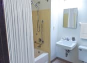 Thumbnail 15 of 16 - a bathroom with a shower and a sink and a shower curtain