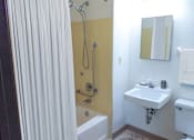 Thumbnail 10 of 12 - a bathroom with a shower and a sink and a shower curtain