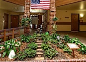 Thumbnail 3 of 12 - an indoor garden in a lobby with a flag