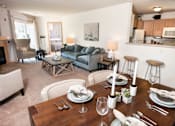 Thumbnail 17 of 20 - Large open-concept floor plans with breakfast bar and dining area