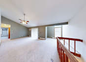 Thumbnail 10 of 50 - A spacious room with a ceiling fan and a balcony.
