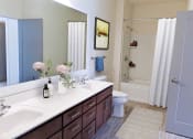 Thumbnail 13 of 64 - a bathroom with a sink and a toilet and a shower