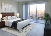 Thumbnail 15 of 64 - a bedroom with a bed and a sliding glass door