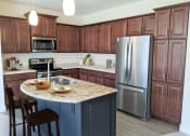 Thumbnail 3 of 64 - a kitchen with stainless steel appliances and a granite counter top