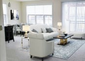 Thumbnail 17 of 64 - a living room with white furniture and a fireplace