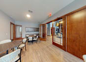 Thumbnail 63 of 64 - A room with a long table and chairs.