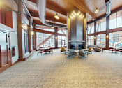Thumbnail 45 of 64 - A large open room with a fireplace and lots of windows.