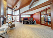Thumbnail 62 of 64 - A large room with a fireplace and a long table.