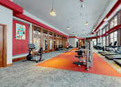 Thumbnail 5 of 64 - A gym with treadmills and exercise bikes.