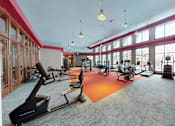 Thumbnail 53 of 64 - A gym with treadmills and exercise equipment.