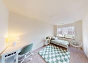 Thumbnail 59 of 65 - A white room with a green chair and a hanging swing.