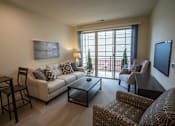 Thumbnail 6 of 53 - a living room with a couch and a table