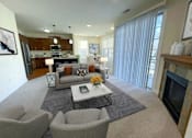Thumbnail 15 of 53 - a living room with a couch and a table