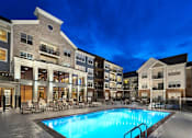 Thumbnail 12 of 53 - a swimming pool in the middle of an apartment building