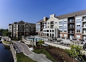 Thumbnail 1 of 53 - an exterior view of an apartment building with a swimming pool
