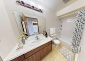 Thumbnail 4 of 4 - a bathroom with a sink and a shower and a toilet