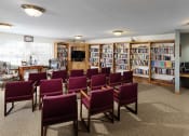 Thumbnail 21 of 22 - a conference room with chairs in front of a library