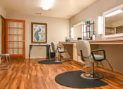 Thumbnail 11 of 22 - a salon room with three chairs and a counter