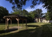 Thumbnail 11 of 21 - a gazebo with a house in the background