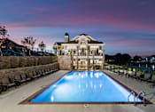 Thumbnail 41 of 53 - a swimming pool in front of a house with a pool