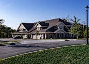 Thumbnail 18 of 53 - a large house on a street corner with a street light