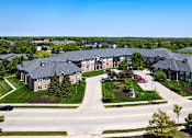 Thumbnail 6 of 14 - an aerial view of an apartment complex on a street