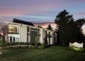 Thumbnail 16 of 31 - a view of a house with a sunset behind it
