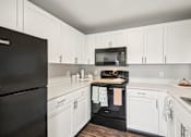 Thumbnail 3 of 77 - Kitchen With White Cabinets at CenterPointe Apartments & Townhomes, New York, 14424
