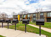 Thumbnail 113 of 124 - A row of black mailboxes in front of a building.