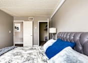 Thumbnail 120 of 124 - A bedroom with a large bed and a lamp.