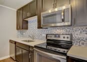 Thumbnail 26 of 111 - Apartment Home Kitchen at Woodland Ridge Apartments at 3420 Joann Lane in Woodridge IL