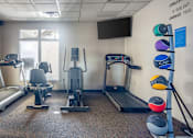 Thumbnail 45 of 66 - A gym with a sign that says "Challenge doesn't change you."