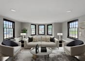 Thumbnail 1 of 29 - A modern living room with a large sofa, two chairs, and a coffee table.
