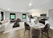 Thumbnail 3 of 29 - A modern living room with a dining area and kitchen in the background.