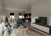 Thumbnail 16 of 27 - A modern living room with a white couch and a television.
