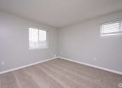 Thumbnail 15 of 50 - an empty room with carpet and two windows at Centerpointe Apartments, New York
