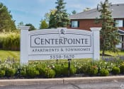 Thumbnail 38 of 50 - a sign for the centerpoint apartments and townhomes in front of a house at Centerpointe Apartments, Canandaigua, NY, 14424