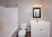 Thumbnail 20 of 50 - a bathroom with a sink toilet and a bath tub at Centerpointe Apartments, New York, 14424