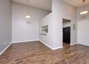 Thumbnail 2 of 50 - an empty living room with wood flooring and white walls and ceilings at Centerpointe Apartments, New York