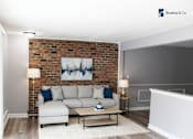 Thumbnail 9 of 17 - A living room with a brick wall and a white couch.