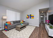 Thumbnail 19 of 77 - Living Room With TV at CenterPointe Apartments & Townhomes, Canandaigua, 14424