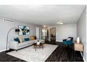 Thumbnail 17 of 77 - Living Room With Kitchen View at CenterPointe Apartments & Townhomes, Canandaigua, NY