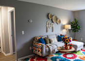 Thumbnail 8 of 67 - Living Room Sofa at Highview Manor Apartments, Fairport, New York