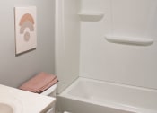 Thumbnail 58 of 61 - a white toilet sitting next to a white bath tub