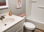 Thumbnail 60 of 61 - a bathroom with a sink toilet and bathtub
