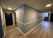 Thumbnail 43 of 54 - Renovated Hallway at  Lincoln Square Apartments at 4055 Knoll Drive in Hamburg, NY