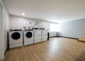 Thumbnail 84 of 103 - Renovated Laundry Area at Willowbrooke Apartments & Townhomes at 396 Willowbrooke Drive in Brockport, NY 14420