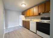 Thumbnail 82 of 103 - Kitchen with wooden cabinets at Willowbrooke Apartments & Townhomes at 396 Willowbrooke Drive in Brockport, NY 14420