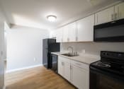 Thumbnail 6 of 103 - Renovated Kitchen with light at Willowbrooke Apartments & Townhomes at 396 Willowbrooke Drive in Brockport, NY 14420